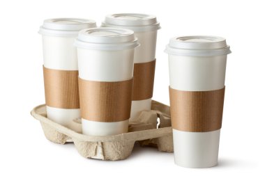 Four take-out coffee. Three cups in holder. clipart