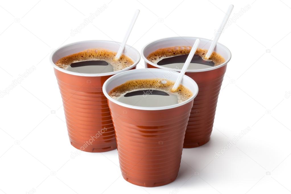 Three plastic vending cups filled with coffee