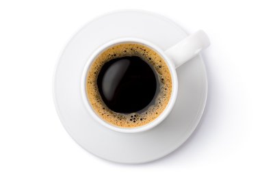 uçan daire üzerinde beyaz Seramik Kahve kupa. Üstten Görünüm.