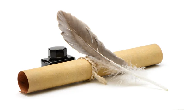 A feather pen, ink,rolls of old yellowed paper — Stock Photo, Image