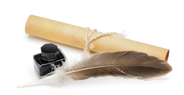 A feather pen, ink,rolls of old yellowed paper — Stock Photo, Image