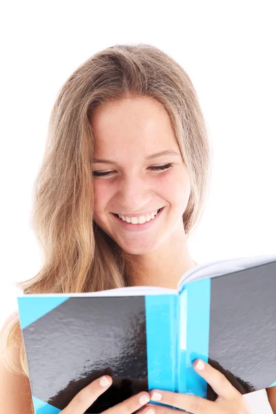 Smiling teenager reading a book Stock Photo