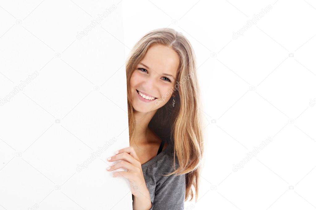 Smiling teenager with blank board