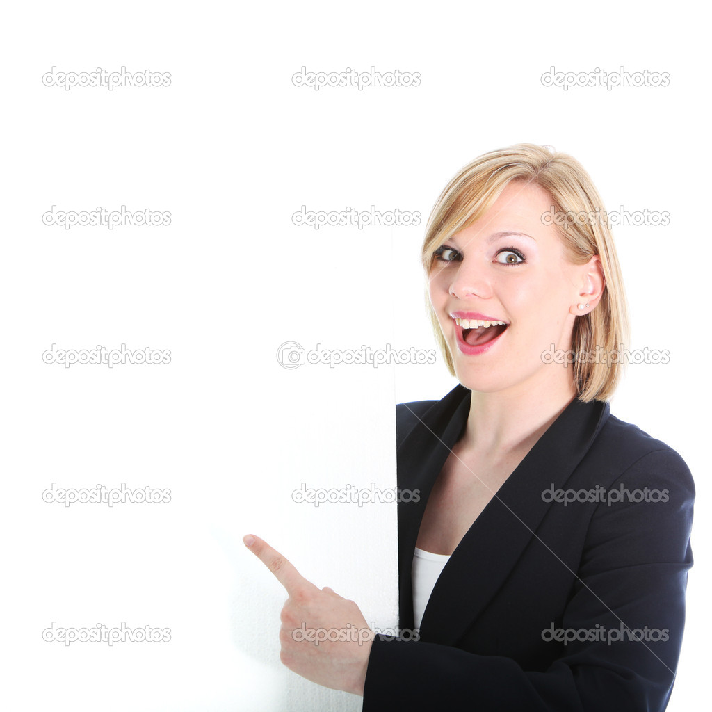 Excited woman pointing to a blank sign