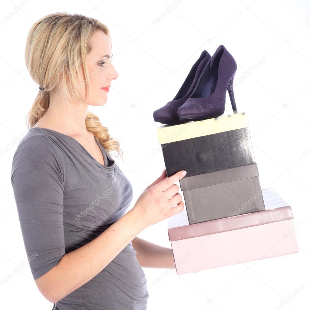 Happy Blonde Woman Holding Boxes of Shoes