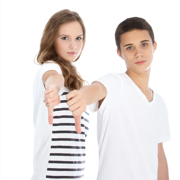Unimpressed teenagers giving a thumbs down — Stock Photo, Image