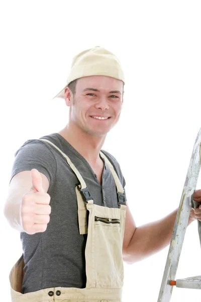 Fröhlicher Heimwerker gibt den Daumen nach oben — Stockfoto