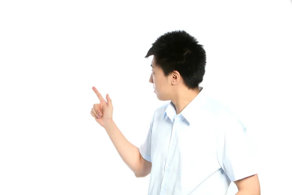 Asian man pointing behind him — Stock Photo, Image