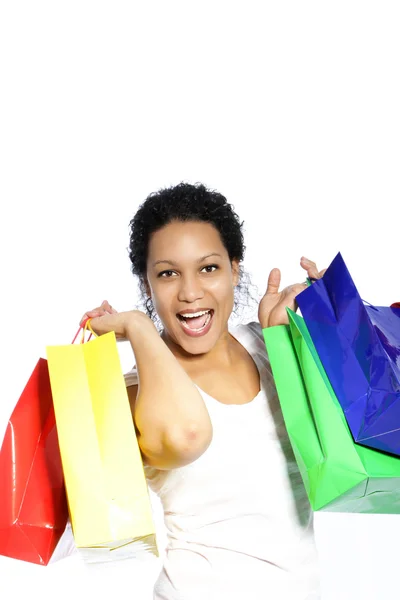 Smějící se žena s barevnými nákupní tašky — Stock fotografie