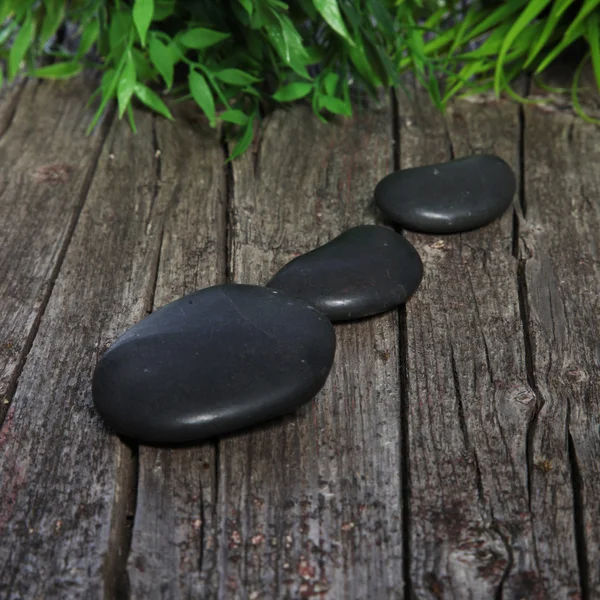 Smooth black basalt spa stones — Stock Photo, Image