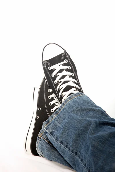 Person in jeans and sneakers — Stock Photo, Image