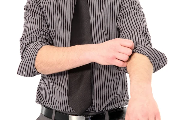 Hombre enrollándose las mangas de su camisa — Foto de Stock
