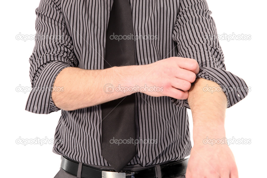 Man rolling up his shirt sleeves