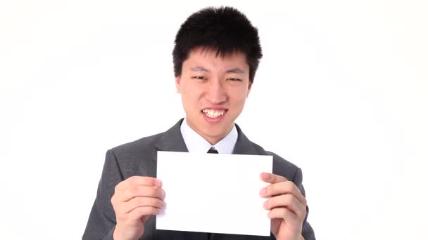 Young Asian businessman holding up a white paper — Stock Video