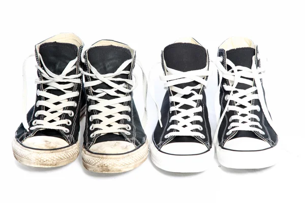 Two pairs of sneakers - one old, one new — Stock Photo, Image