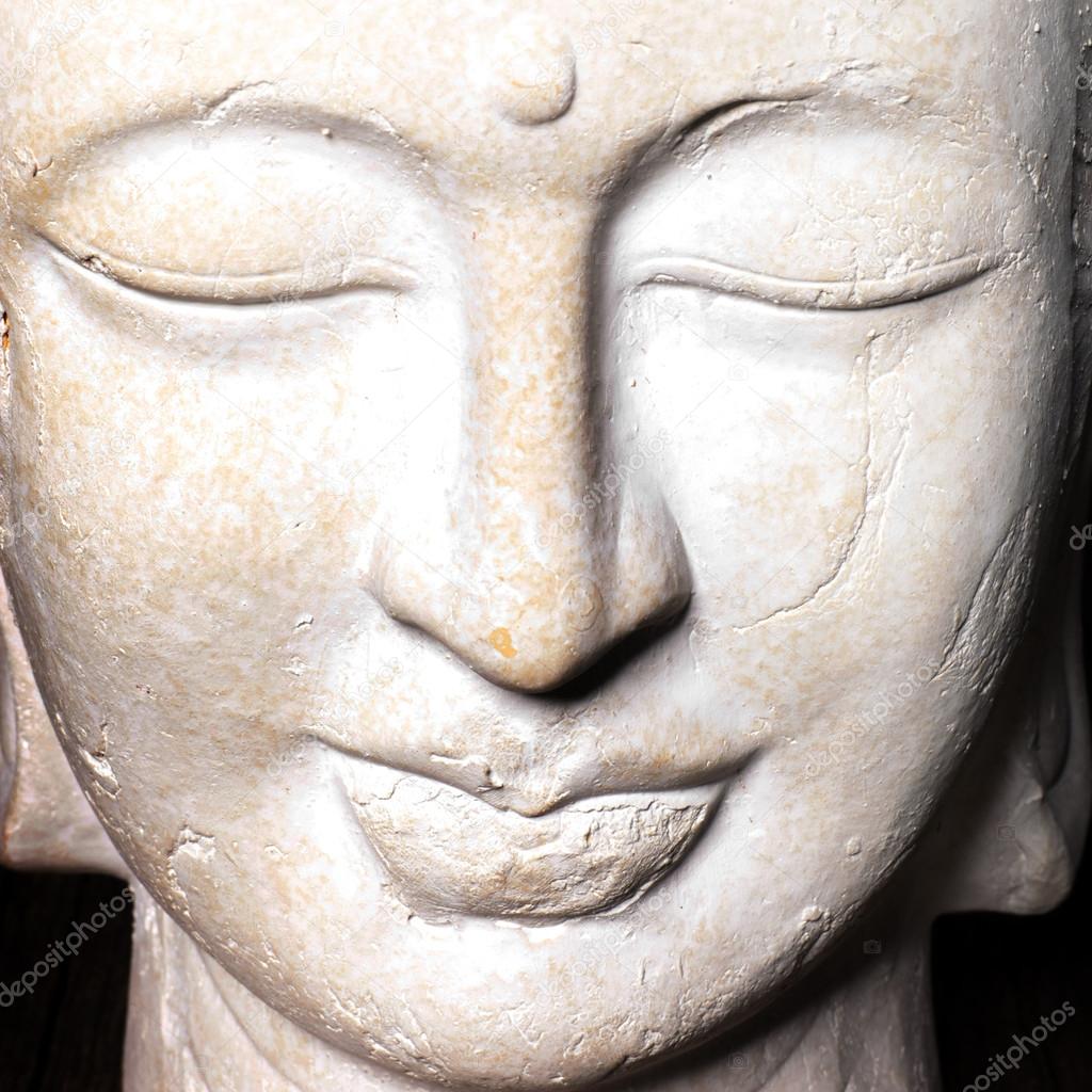 Serene face of a stone Buddha