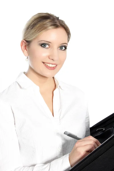 Beautiful young woman writing in a file Stock Photo