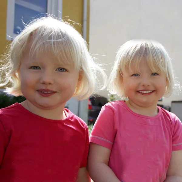 Pair of cute identical twins — Stock Photo, Image