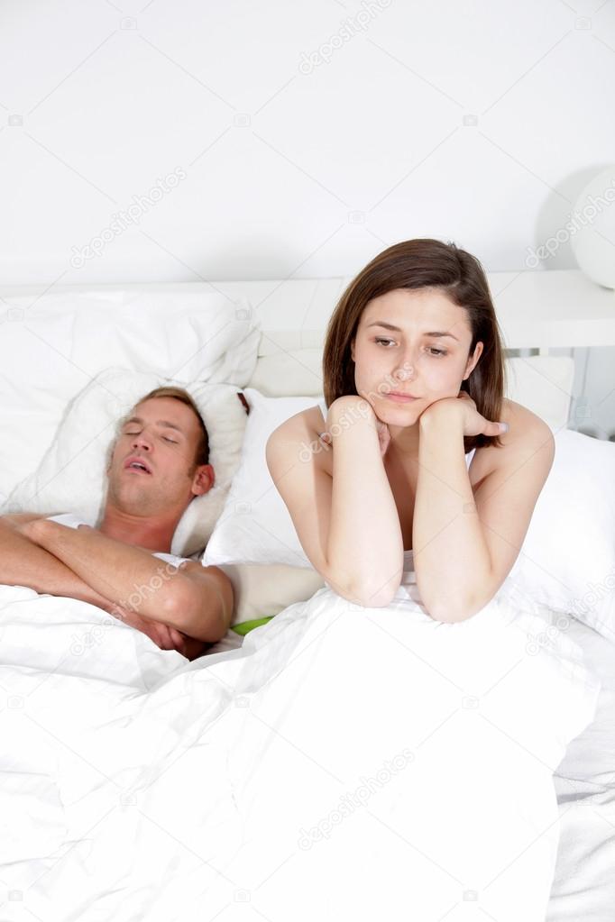 Snoring man, distraught woman
