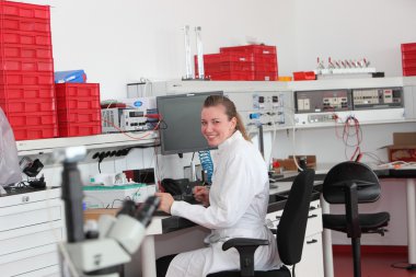 Confident female laboratory technician clipart