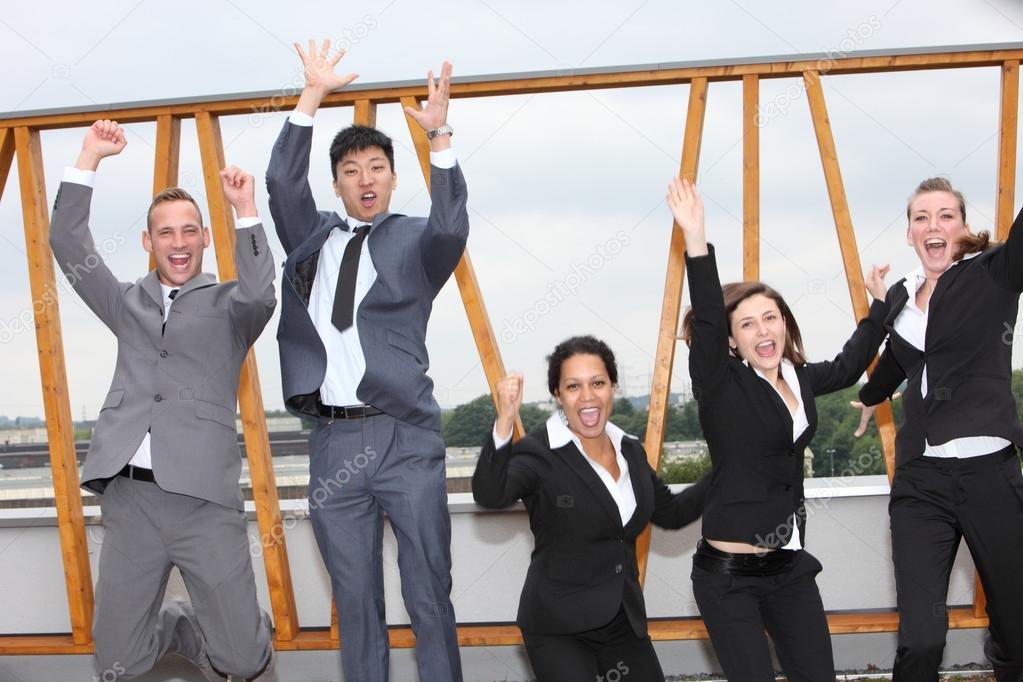 Successful business team cheering and rejoicing