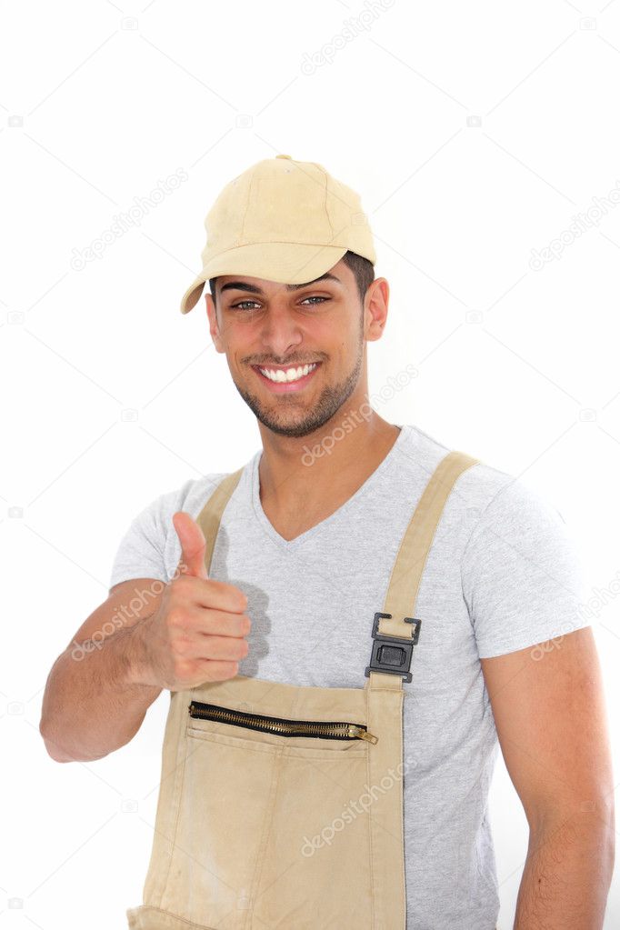 Confident workman giving a thumbs up