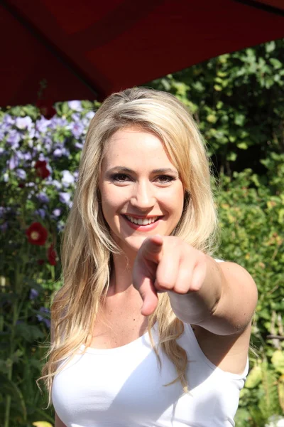 Beautiful woman pointing at the camera — Stock Photo, Image