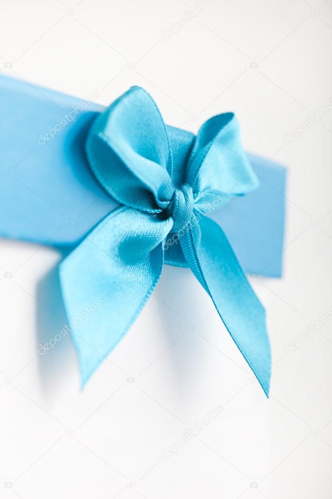 pretty turquoise blue bow and ribbon on a gift box