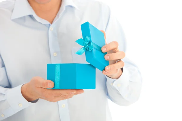 Man opening a birthday or Christmas gift — Stock Photo, Image