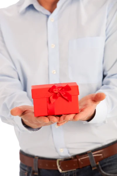 Man offering a romantic Valentines or Xmas gift — Stock Photo, Image