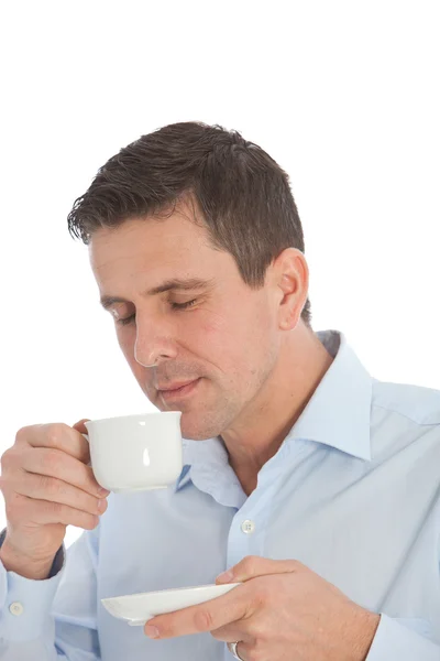 Man savouring the aroma of a cup of coffee — Stock Photo, Image