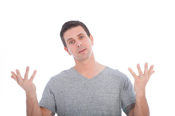 Confused man raising his upturned palms — Stock Photo, Image