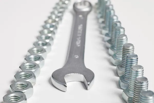 Arrangement of a spanner, bolts and nuts — Stock Photo, Image