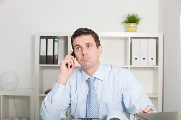 Businessman listening to his mobile — Stock Photo, Image