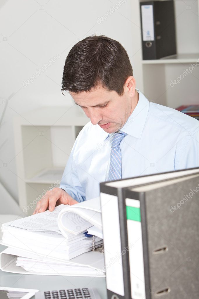 Businessman hard at work doing research