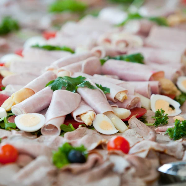 Asparagus rolled in ham on a buffet table — Stock Photo, Image