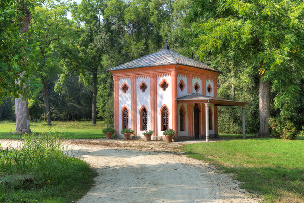 Small guest house along footpath among trees at Racconigi park in Northern Italy.