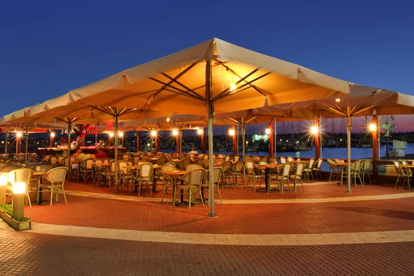 Outdoor restaurant at sunset. — Stock Photo, Image