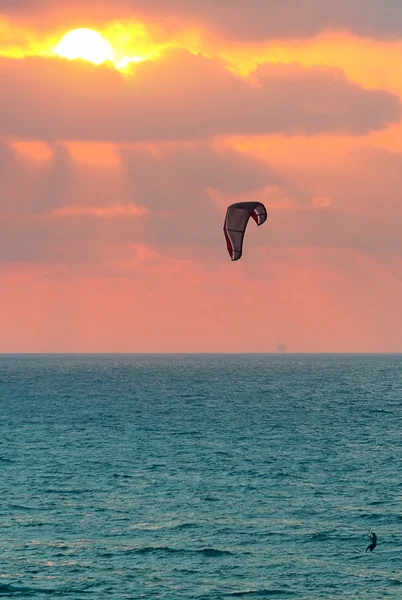 Kitesurfer on Mediterranean sea at sunset in Israel. — Stock Photo, Image