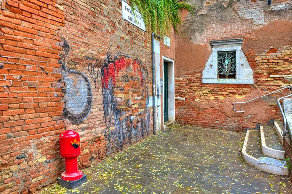 Brick walls and small courtyard in Venice, Italy.
