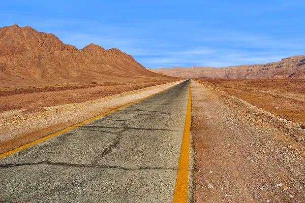 Road through red mountains in Timna park, Israel. Royalty Free Stock Images
