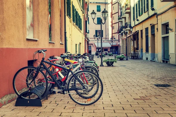 Bicycles in a row on the street of Ventimiglia. — Stock Photo, Image