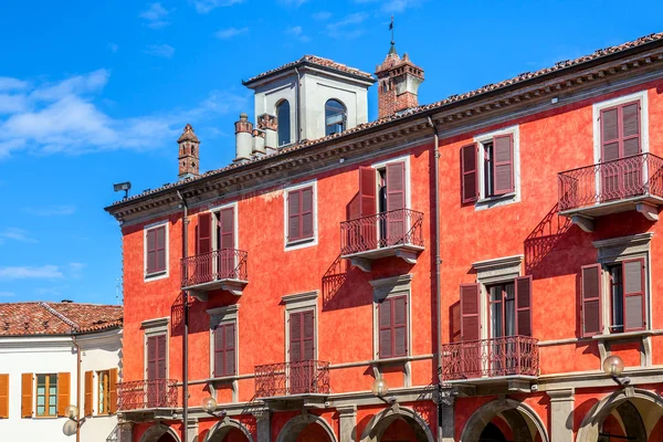 Red two storey building in Alba, Italy. — Stock Photo, Image
