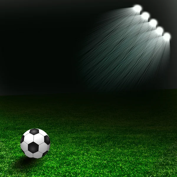 Ballon de football sur le terrain vert avec lumière — Photo