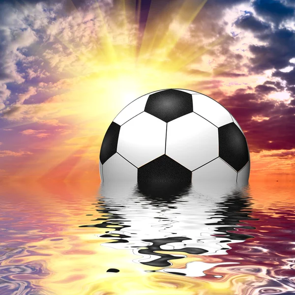 Soccer ball reflected in water over the blue sky with sunset — Stock Photo, Image