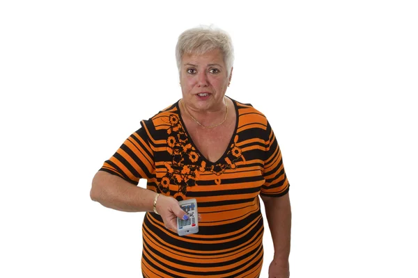 Senior woman zapping with remote control — Stock Photo, Image