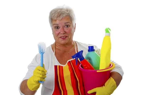 Vrouwelijke senior met het schoonmaken van gebruiksvoorwerpen — Stockfoto