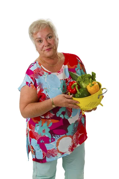 Femme âgée avec des légumes frais — Photo