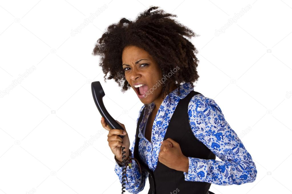 Angry african american woman with handset