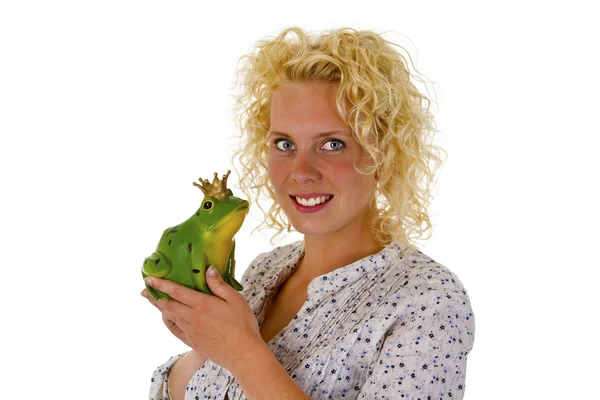 Young woman kissing a frog prince — Stock Photo, Image